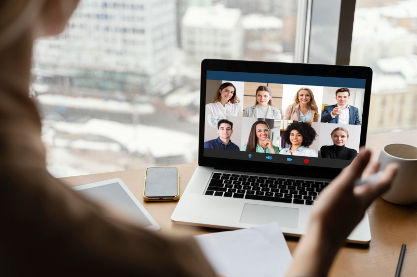 Creator hosting a video call with community members on a laptop, building connection beyond social media posts.